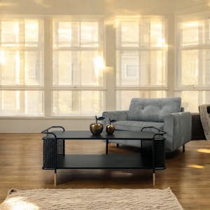 Table basse noire pieds dorés double plateau